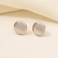 Detailed macro view of pair of 304 stainless steel minimalist round stud earrings on beige fabric - D164-Silver Circle Flat
