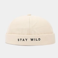 Detail of Stay Wild letter embroidery on off-white canvas docker brimless cap - Adjustable / Beige