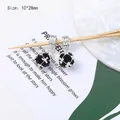 Detail of 10x28mm black faceted bead charm with silver cage and large hole bail - Black Zirconia