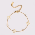Macro detail of gold-plated clover bracelet with sparkling cubic zirconia settings - Gold
