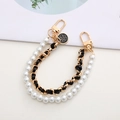 Detail of double-layer phone chain with white pearls, black leather, and camellia charm - Leather Woven Double Chain Strap / Black