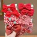 8-piece set of red bow hair ties for girls in assorted textures on display cards - Red Fragrance Style (0662-7)