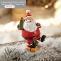 Resin Santa Claus figurine with green gift box standing on orange bag decoration - Medium Santa Claus Style B (On Gift Bag)