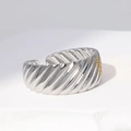 Macro shot of wide silver stainless steel ring featuring unique diagonal wave textures - Size 7 (Adjustable) / Steel