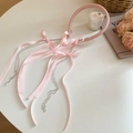 Close-up of pink fabric headband featuring long ribbon streamers and crystal bead tassels - Pink Headband With Pink Bow Tassel