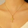Detailed close-up of a minimalist 18k gold plated cross pendant necklace on a model - 18K Real Gold H-167 Simple Smooth Surface Cross Necklace