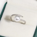 Close-up of adjustable silver ring with large white pearl and zircon accents in a box - Large Round Bead Rhinestone (White Gold Color 16)