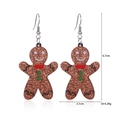 Gingerbread man earrings detail showing brown glitter finish and 6.7cm height measurement - Chocolate Gingerbread Man Earrings