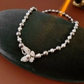 Elegant necklace with grey pearls and a sparkling zircon-studded butterfly pendant - Mixed Color (6-8mm)