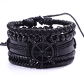 Close-up of black multilayer leather bracelet with braided rope and nautical rudder charm - Ship Wheel