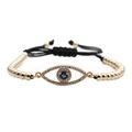 Pulsera ajustable ojo turco con baño de oro y circonitas sobre cordón negro trenzado - Dorado