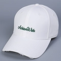 Detail of white cotton baseball cap showing AchieveWish embroidery and distressed brim edge - M (56-58cm) / White