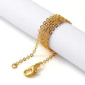 Close-up of a delicate golden cross chain wrapped on white roll with lobster clasp - 42.5cm / Gold O-Chain