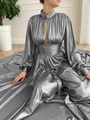 Detailed view of silver pleated dress featuring high neck, cutout chest, and long sleeves - S / Silver
