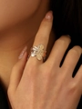 Textured rose gold flower ring with intricate metal petal details on model hand - Gold Flower Ring (G-434)