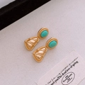 Macro view of vintage gold earrings with turquoise stones and fan-shaped relief detail - 39# Silver Earring Post-Gold-Blue