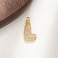 Detailed close-up of a gold L-shaped letter pendant fully set with sparkling cubic zirconia - L
