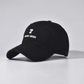 Detailed view of white embroidery on black cotton baseball cap with 3D number seven - Black
