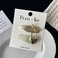 Golden bow and heart hair clip set with metallic texture on white display card - Knotted Bow with Heart