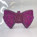 Elegant bow-shaped evening clutch bag adorned with sparkling pink crystals and metal frame - Purplish Red