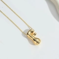 Modern balloon style letter F pendant necklace in shiny gold finish on white background - Letter F