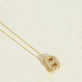 Elegant gold chain necklace featuring a minimalist letter B pendant with micro-inlaid zircon - Letter B