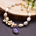 Baroque pearl bracelet with gold flower charms and a blue teardrop stone pendant - Lapis Lazuli Pendant Clover Pearl Bracelet