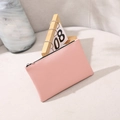 Pochette cosmétique fine en cuir PU rose avec texture litchi et fermeture éclair argentée - Rose
