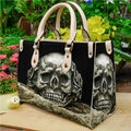 Gothic black PU leather shoulder bag with silver skull pattern shown in a garden setting - Silver 3D Skull (Handbag 0047)