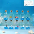 Lot de 10 mini bouteilles décoratives avec liquide bleu et figurines marines miniatures - Série Océan
