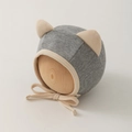 Detail of grey newborn hat with cat ears and ribbed cotton fabric for babies - 0-12 Months / Gray
