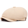 Dettaglio del berretto newsboy beige in tessuto strutturato con bottone laterale in pelle - Regolabile / Cachi