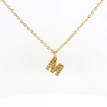 Golden stainless steel necklace featuring a crystal paved letter M alphabet pendant - Gold Letter M