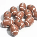 Macro shot of brown acrylic American football beads with white stitching for crafts - 19*13mm Coffee White Line Rugby
