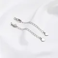Detail of silver extender chain with lobster clasp and heart pendant on white silk - White Gold Color Smooth Heart