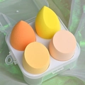 Set of 4 soft yellow and orange makeup sponges in a clear storage box - Cheese Mango 4-Piece Set