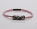 Detail showing pink braided leather bracelet with silver magnetic cross clasp - Platinum R