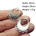 Macro shot of Tibetan silver alloy connector pendant for DIY earrings, size 20x28mm - No.10/Crescent Geometric