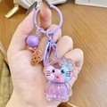 Cute purple cartoon kitty liquid quicksand backpack keychain with a matching small bell - Purple Hello Kitty Milk Bean