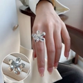 Vintage style silver floral bow open ring on model finger with a macro detail closeup - Five Petal Mirror Flower(JZ7392)