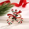 Broche de bastón de caramelo navideño con lazo rojo y acabado de esmalte - Br0008