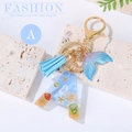 Initial letter A keychain with ocean beach resin, sand, shells and blue tassel - Letter A