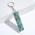 Detail of colorful rhinestone cylinder keychain with floral patterns and silver ring - C4-Floral Pattern