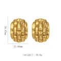 Macro detail of 18k gold stainless steel hoop earrings with woven texture and dimensions - Woven Texture Oval Ear Buckles