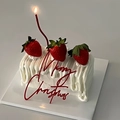 Red acrylic Merry Christmas cake topper on a white cream cake with fresh strawberries - Classic Red
