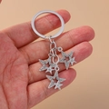 Portachiavi gotico in argento con ciondoli a stella di strass per zaino - Pentagramma