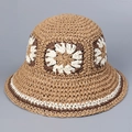 Close-up of handmade crochet straw hat showing intricate flower patterns and textures - Khaki + Coffee