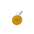 Custom yellow faux leather round keychain with golden hardware and black AP monogram - Assembled / Yellow