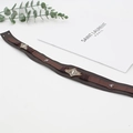 Close-up of brown leather hat band with vintage bohemian metal pieces and studs - Brown Vintage Metal Decor Style (18)