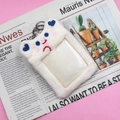 Close-up of a white plush cat-shaped card holder with blue heart ears and a metal ring - White (White Pupu)